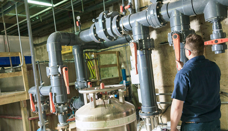 Engineer working with valve equipment on a boiler